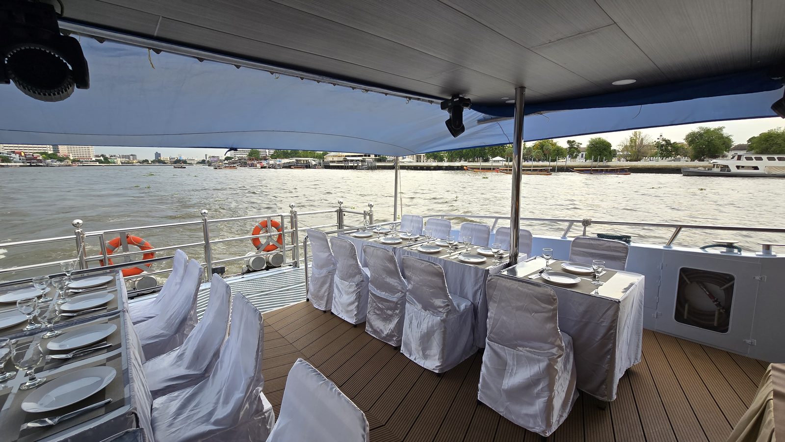 Tables set for a family celebration on the covered aft deck